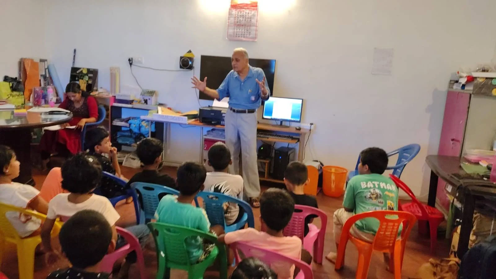 Children gathered with an educator for a shared learning activity